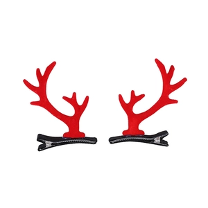 Pair of festive red reindeer antler hair clips with plush texture and black metal pins
