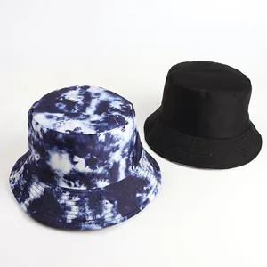 Reversible bucket hat featuring tie-dye pattern and classic black for outdoor sun protection