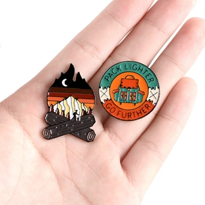 Camping themed alloy enamel pins with mountain campfire design and outdoor slogan