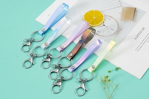 Close-up of colorful iridescent PVC lanyards with metallic rings in six gradient shades
