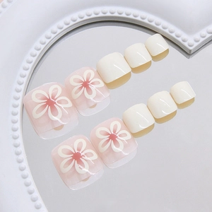 24pcs cream floral press-on toenails in white and pink gradient with mirror reflection