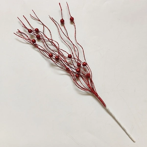 Detail of red glitter berry branches for Christmas tree decor and floral arrangements