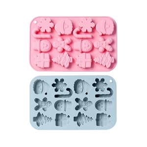 Christmas themed silicone mold set featuring snowman and gingerbread man in pink and blue