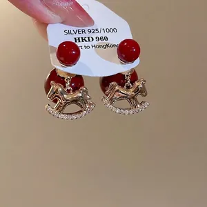 18K gold plated S925 silver stud earrings with red beads and zircon rocking horse charms