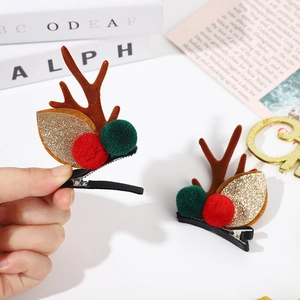 Barrettes de Noël en bois de renne avec pompons et détails à paillettes dorées