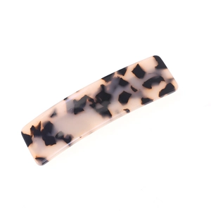 Minimalist acetate hair clip with tortoiseshell leopard pattern on a white background