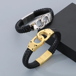 Close-up of black braided leather bracelets with 316L stainless steel handcuff clasp detail