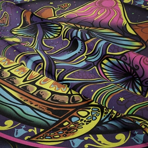 Close-up of psychedelic mushroom tapestry showing soft polyester fabric and vibrant print