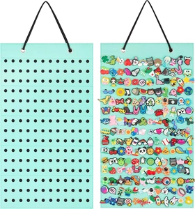 Mint green badge wall display organizer with high-capacity holes shown empty and full