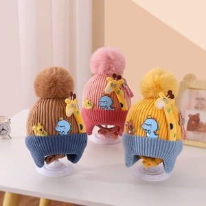 Cozy knit baby hats with earflaps and cute cartoon animal patches in three color schemes