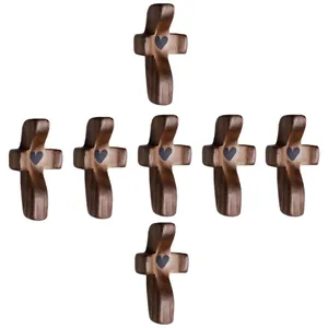 Set of 7 walnut wood clinging crosses with black heart centers for prayer comfort