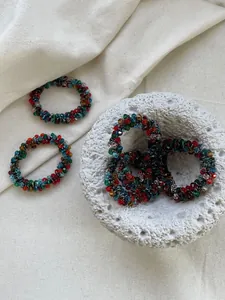 Close-up of colorful beaded crystal elastic hair bands with multi-faceted cut beads
