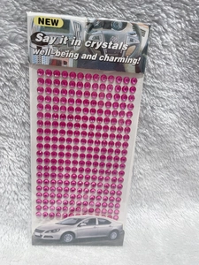 Macro view of bright pink 3mm round acrylic rhinestone stickers for DIY car and craft decor