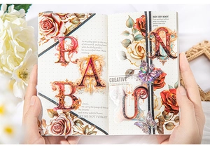 Detailed view of vintage baroque PET stickers featuring floral patterns and letters