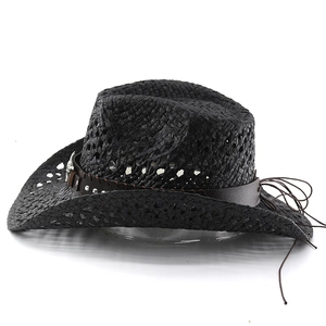 Detail of black woven cowboy hat with studded leather band and silver metal buckle