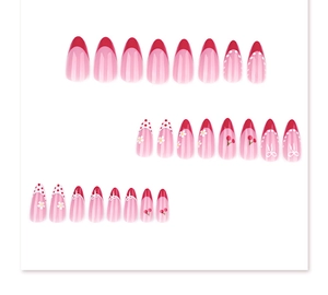 Detail of 24 red French almond press-on nails with daisy, cherry, and bow designs
