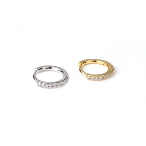 Mini copper hinged hoop earrings with pavé zircons in gold and silver finishes