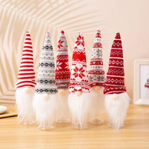 Detail showing 6 Christmas gnome wine bottle covers with knitted hats and faux fur beards