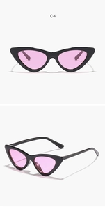 Detail of cat-eye sunglasses with black frame and light pink transparent lenses