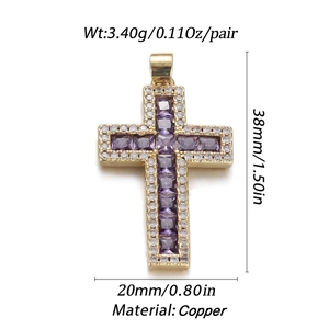 Detail view of a gold copper cross pendant with purple zircon and dimensions 38mm x 20mm