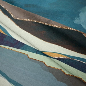 Macro shot of abstract mountain tapestry with blue and gold texture details