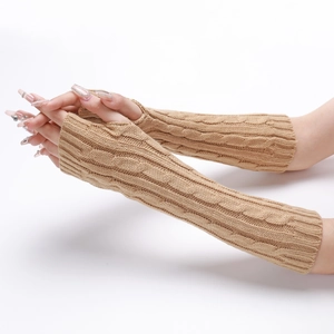 Macro detail of camel cable knit arm warmers showing thick wool texture and thumb holes