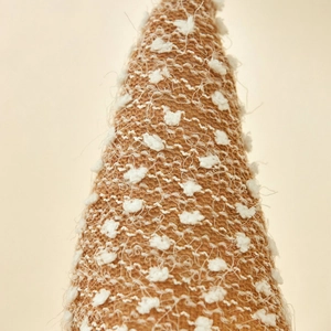 Brown knit Christmas gnome hat with white fuzzy pom-poms for festive holiday decor