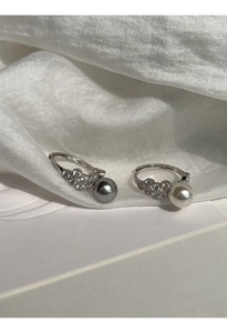 Detailed close-up of S925 sterling silver stamp on the grey pearl ring with lace design