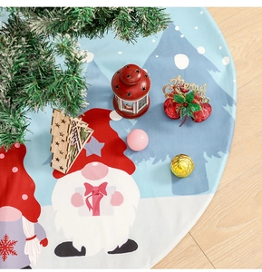 Top view of a blue Christmas tree skirt with festive dwarf and snowflake patterns