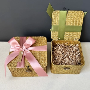Handwoven straw gift box set with natural finish, colorful ribbons and button closure