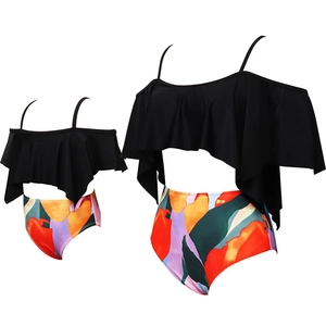 Matching mother daughter ruffled bikini set with black top and floral high waist bottom