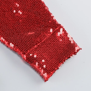 Close-up of vibrant red sequins and detailed stitching on the sequined two-piece set