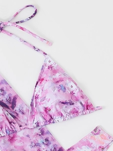 Detail of pink floral halter bikini top with ruffled triangle cups and neck ties