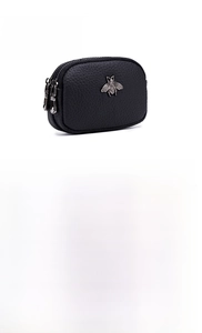 Detail of genuine leather coin purses with bee metal buckle and triple zipper compartments