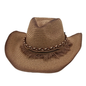 Close-up of woven straw cowboy hat with tricolor rope and fringe tassel detailing