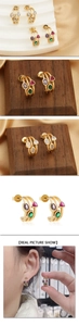 Detail of 18k gold plated hoop earrings with three rows of multi-colored zircon stones