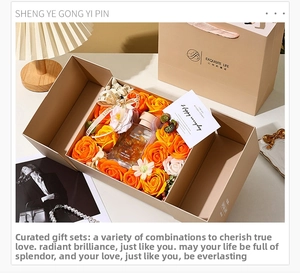Detail view of orange soap flowers and 100ml aromatherapy oil in a beige gift box set