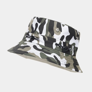 Detail of jungle camo bucket hat featuring metallic eyelets and adjustable sport toggle cord