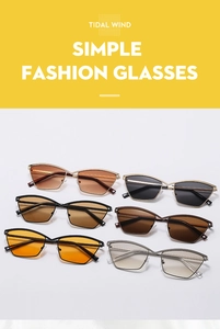 Flat lay of trendy cat-eye metal sunglasses in six different lens colors on white backdrop