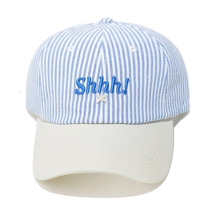 Detail of blue and white striped baseball cap with blue Shhh! letter embroidery