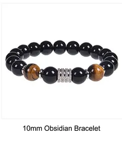 Close-up of 10mm black obsidian beads and brown tiger eye stones on elastic bracelet
