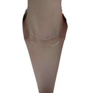 Baroque pearl geometric double-layer necklace in silver finish on a mannequin neck