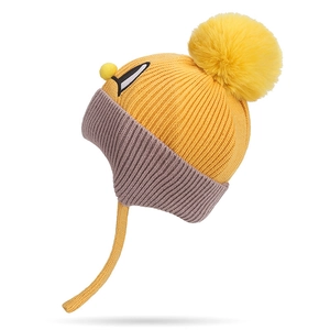 Winter knit ear-protection hat for children with yellow faux fur pompom and cartoon eyes