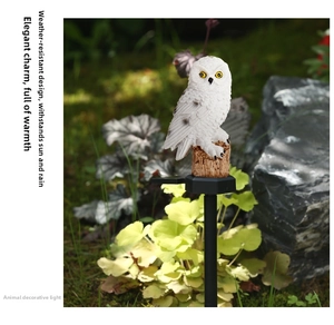 Detail view of solar owl garden light with waterproof resin texture on ground spike