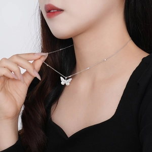 Elegant S925 sterling silver butterfly necklace with colorful zircons on a model