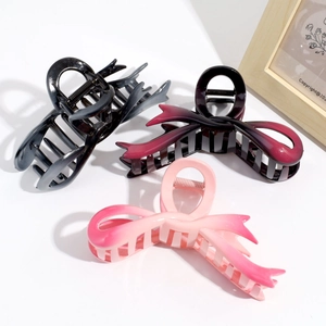 Three-piece set of gradient butterfly hair claws in black, red, and pink resin finishes