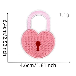 Detailed embroidery of a pink heart-shaped lock iron-on patch with 6.4x4.6cm dimensions