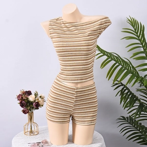 Detailed view of khaki and white striped knit texture on a sexy two-piece crop top set