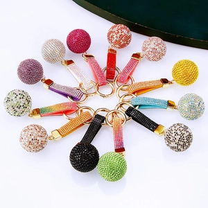 Sparkling crystal ball keychains with rhinestone straps in various vibrant colors