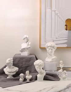 Detailed view of matte white resin sculptures of Greek busts for Nordic home decor